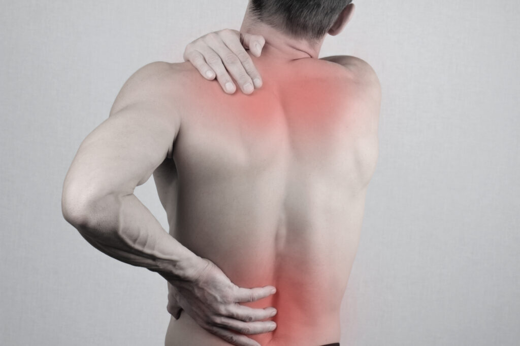 Man with highlighted pain in lower back and shoulders.