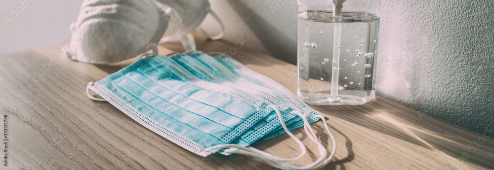 Mask and handsanitzer on the table, as demonstration of covid measures.