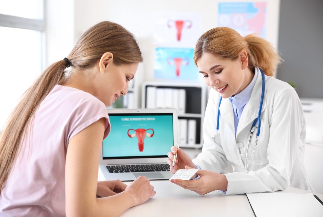 Young woman visiting her gynecologist in clinic Young woman visiting her gynecologist in clinic