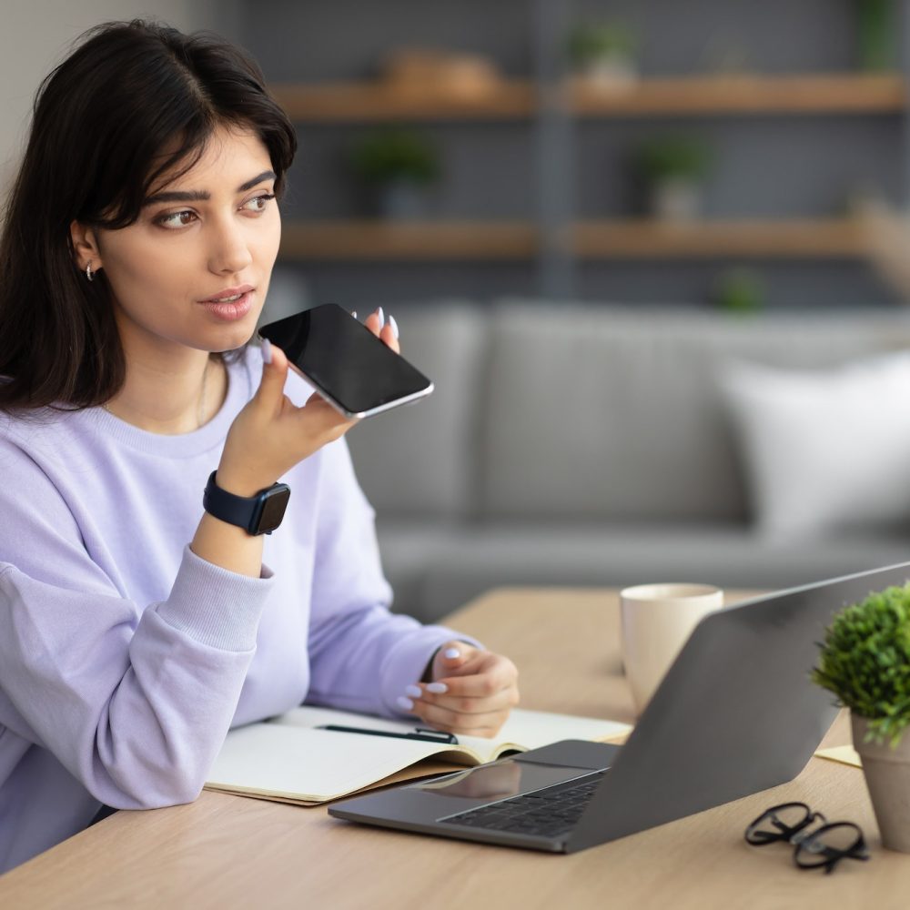 woman-using-voice-search-assistant-on-smart-phone.jpg