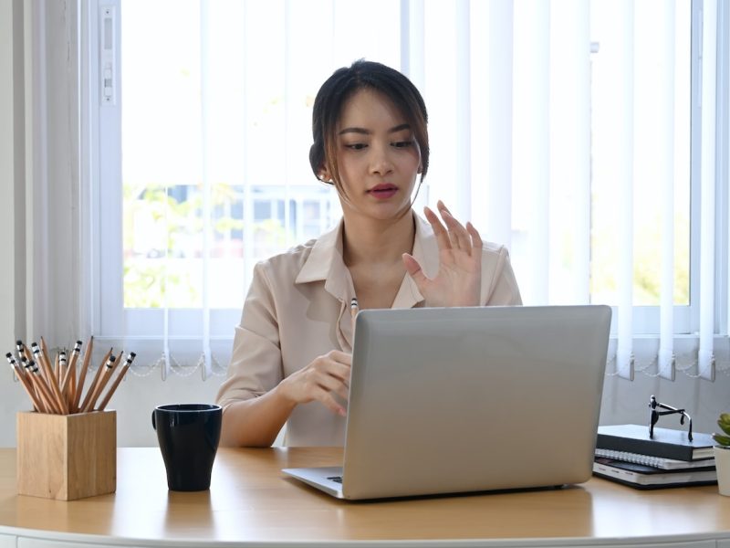 young-businesswoman-using-laptop-computer-virtual-video-conference-with-her-business-partner-.jpg